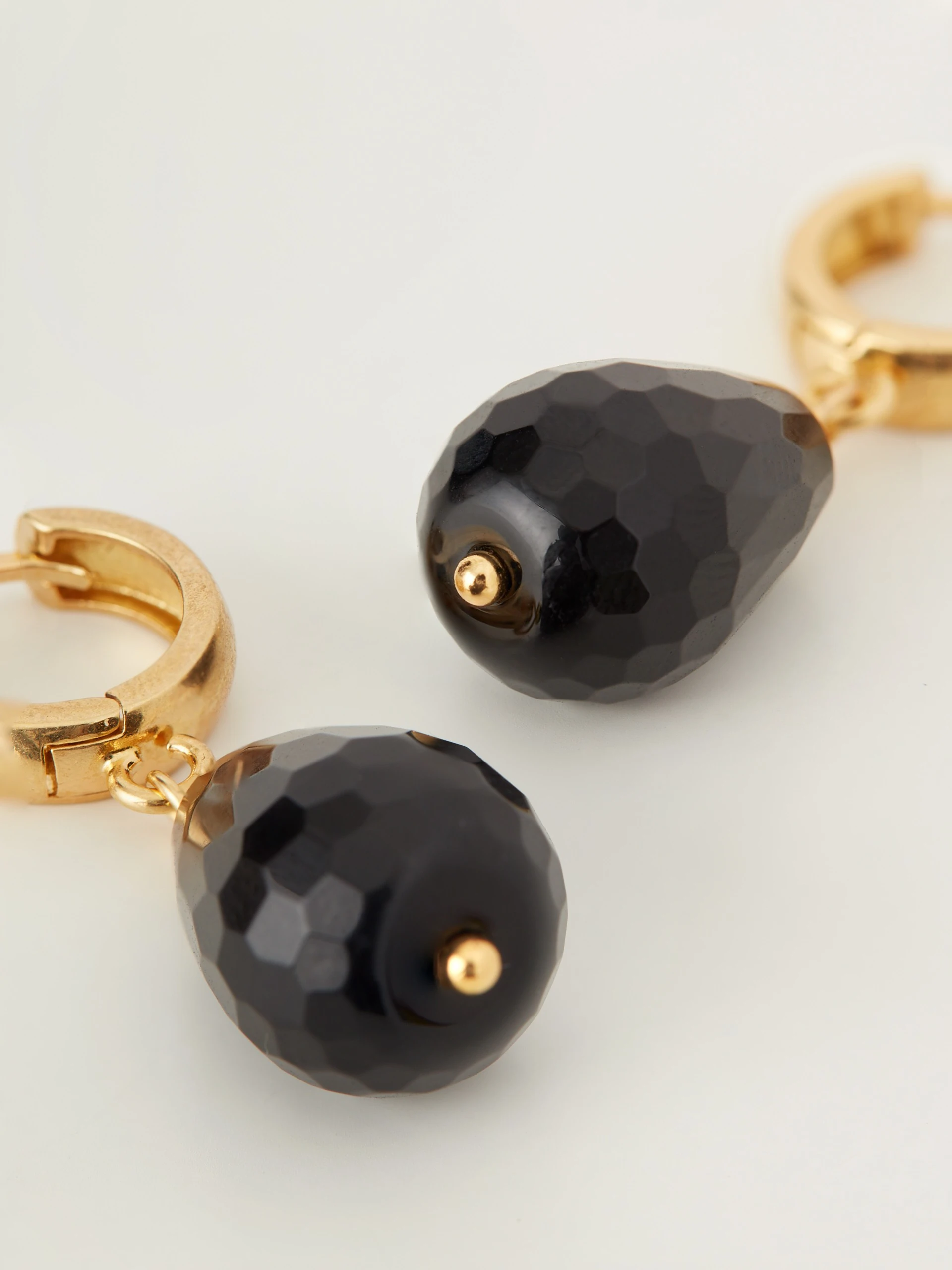 Classic earrings with decorative onyx