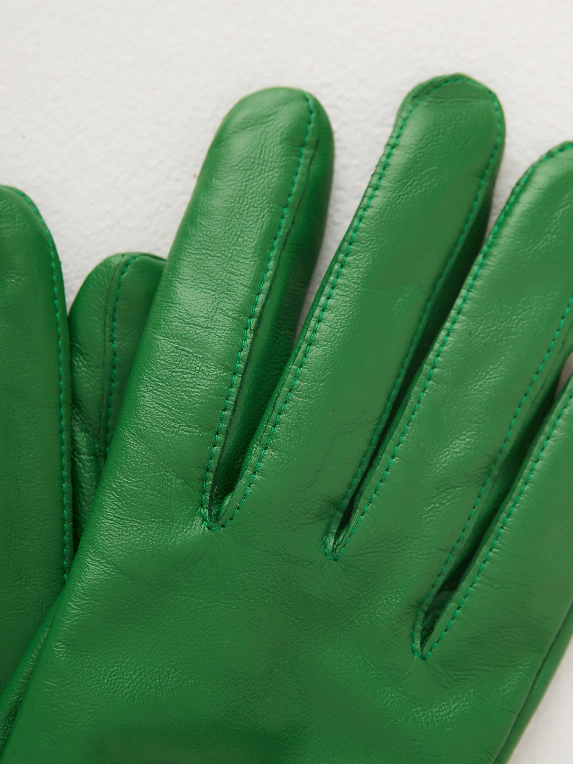 Green leather gloves