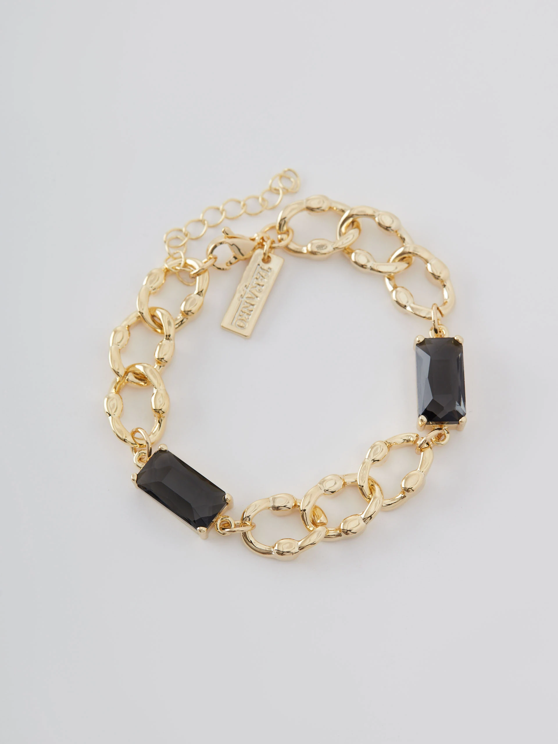 Gold color bracelet with glass stone