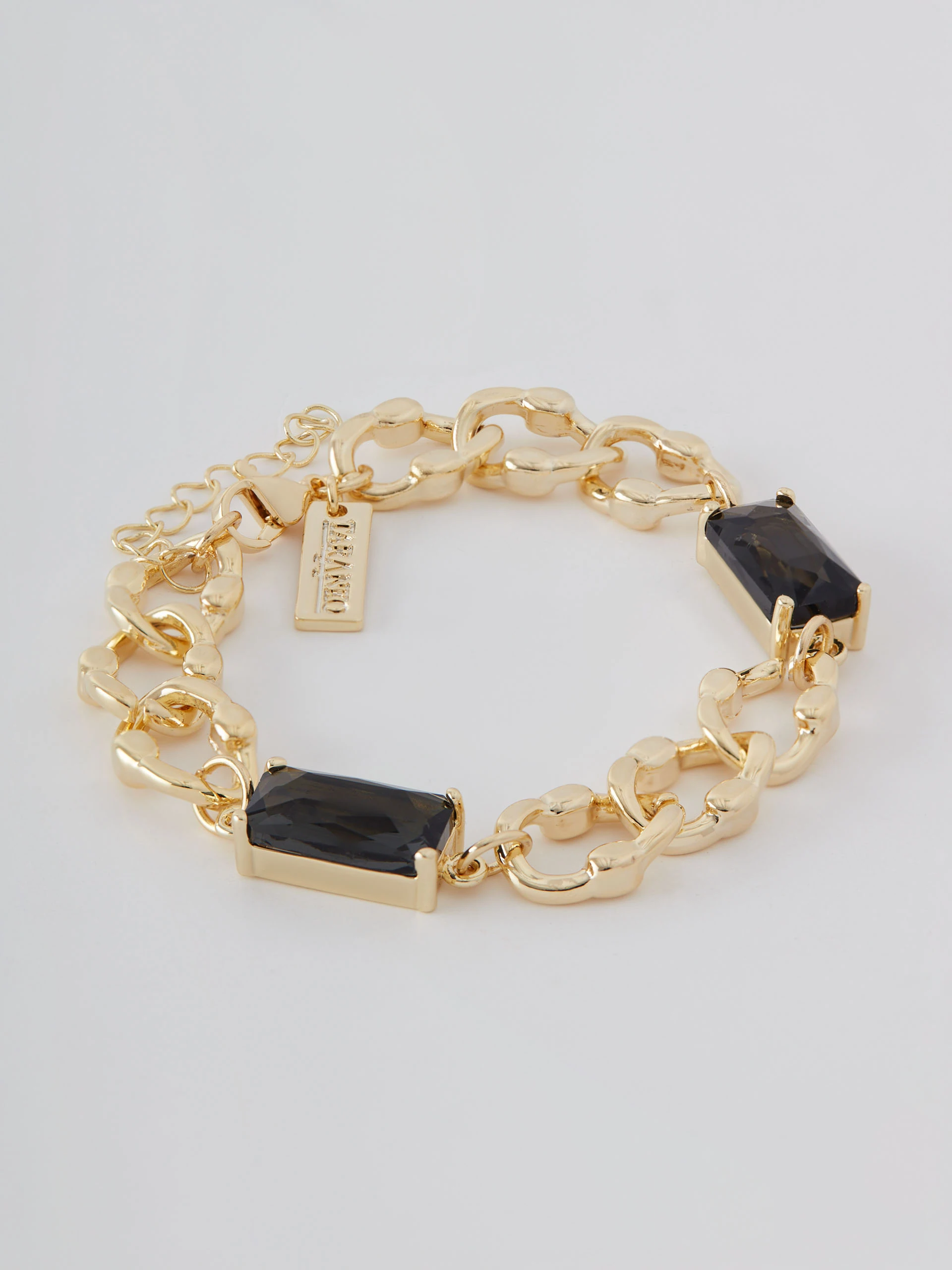 Gold color bracelet with glass stone