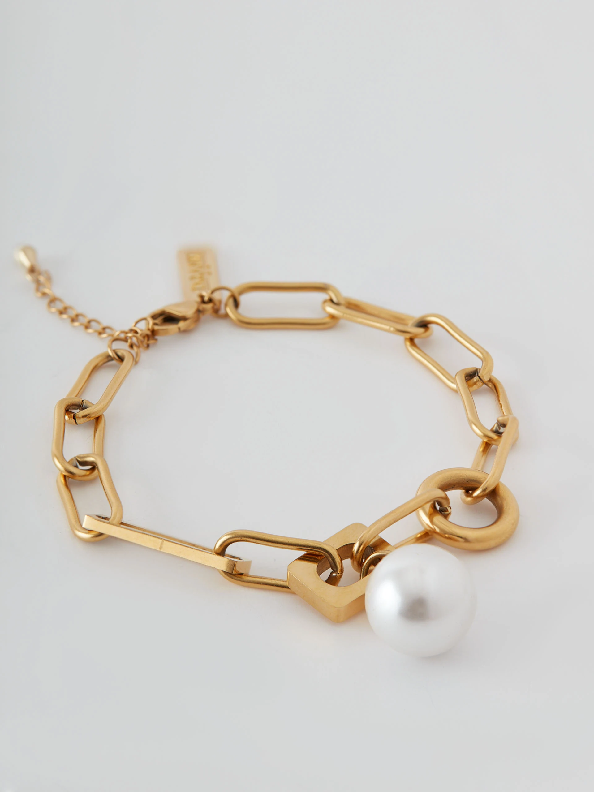 Gold color bracelet with pearl pendant