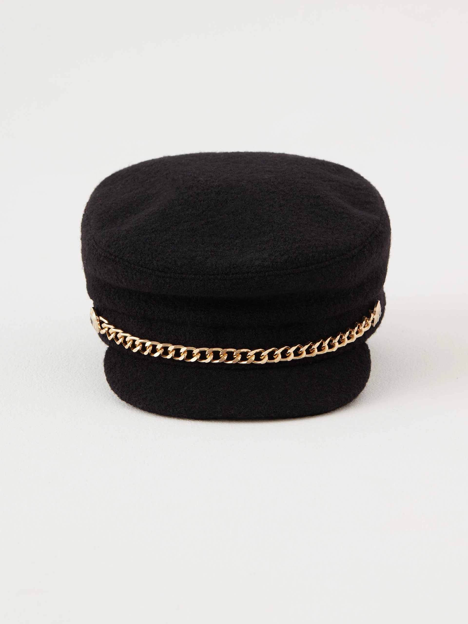 Wool helmet with decorative gold chain