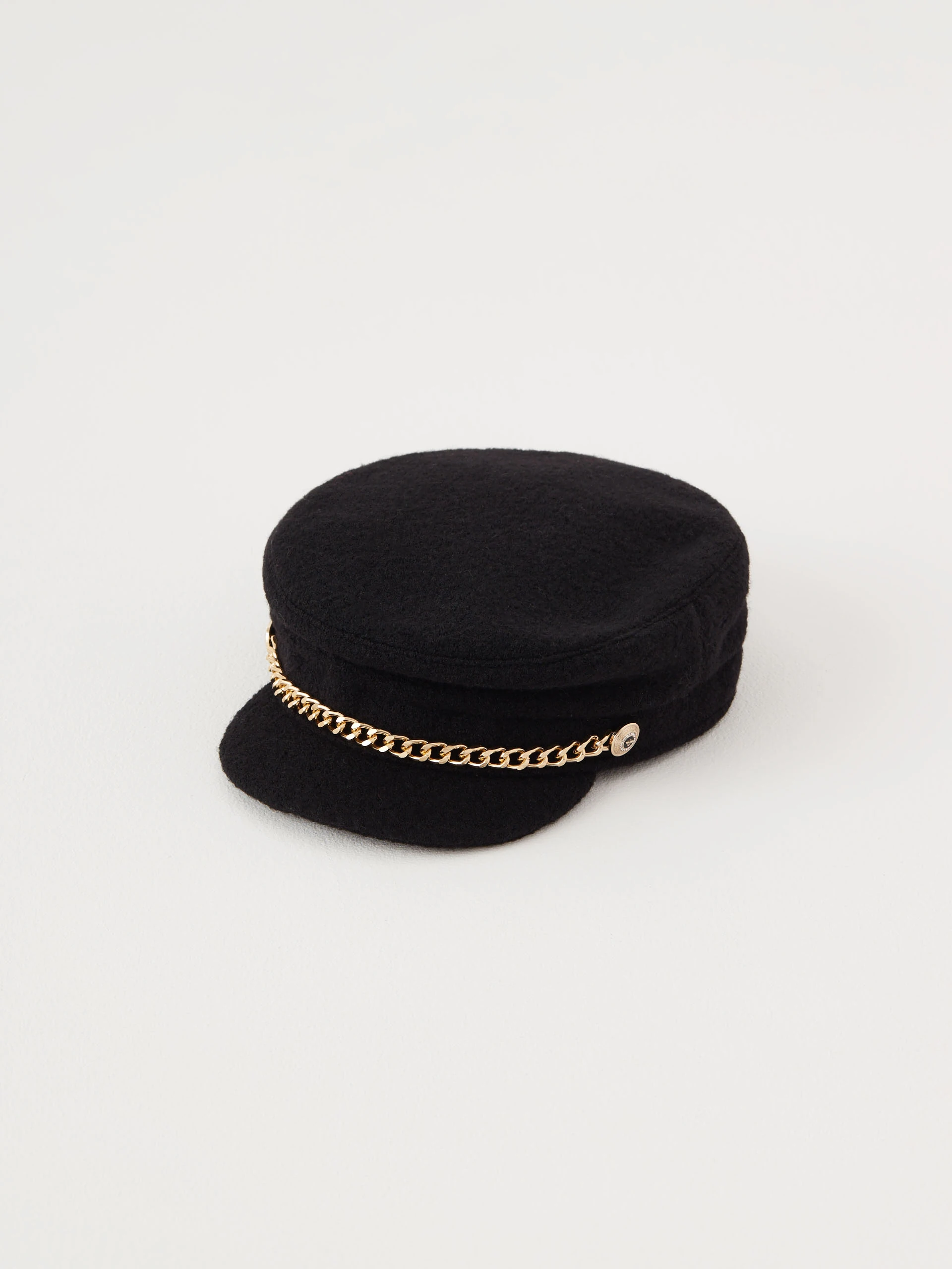 Wool helmet with decorative gold chain