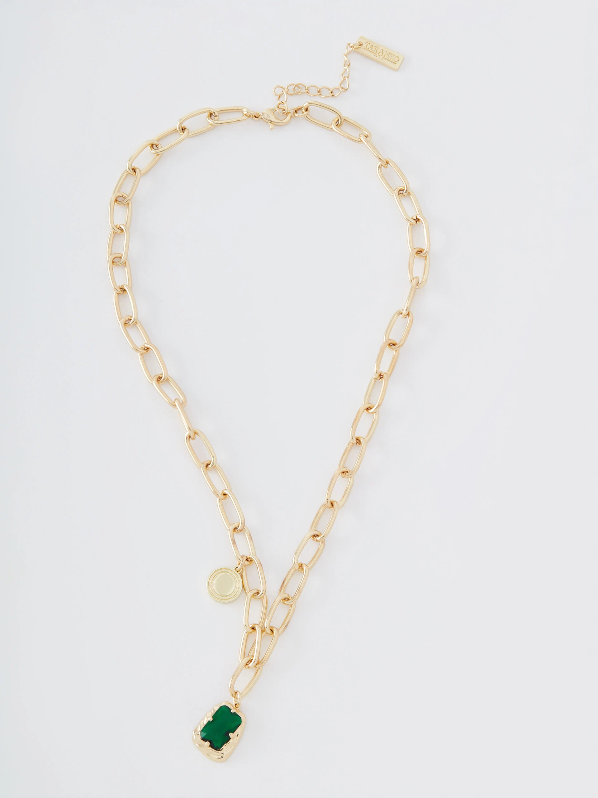 Gold colored necklace with green zirconia