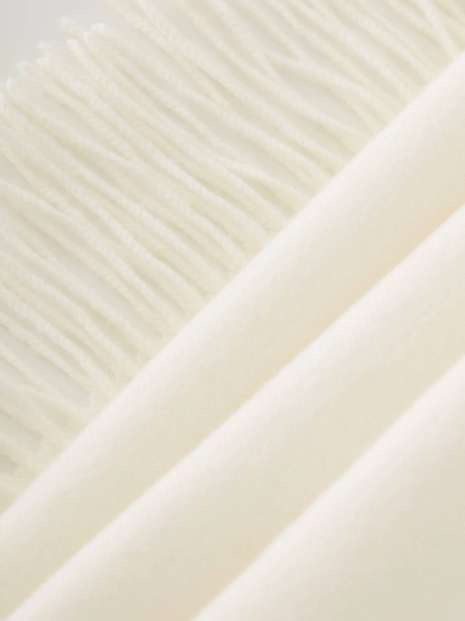 Cream knitted shawl with tassels