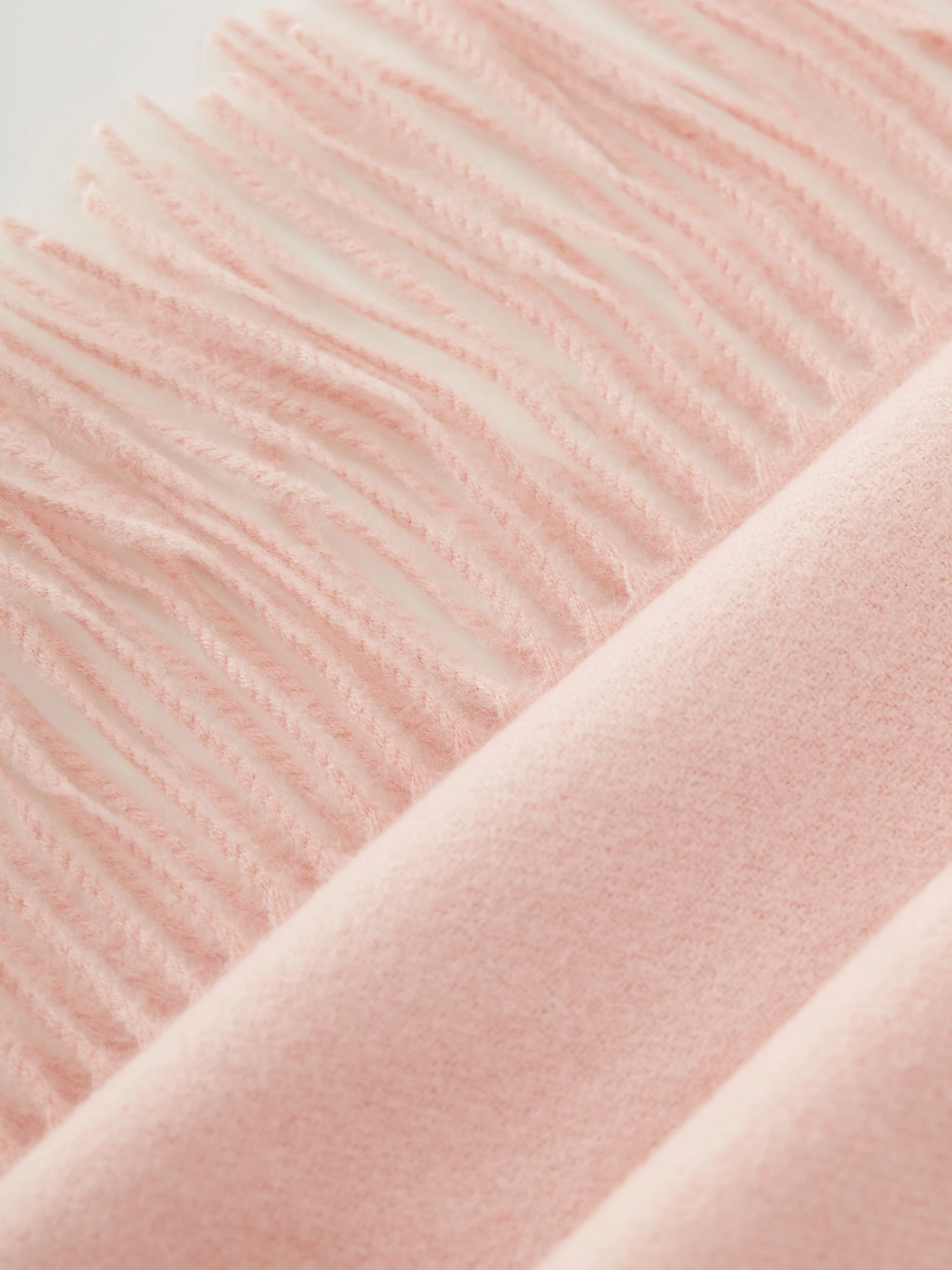 Pink knitted shawl with tassels