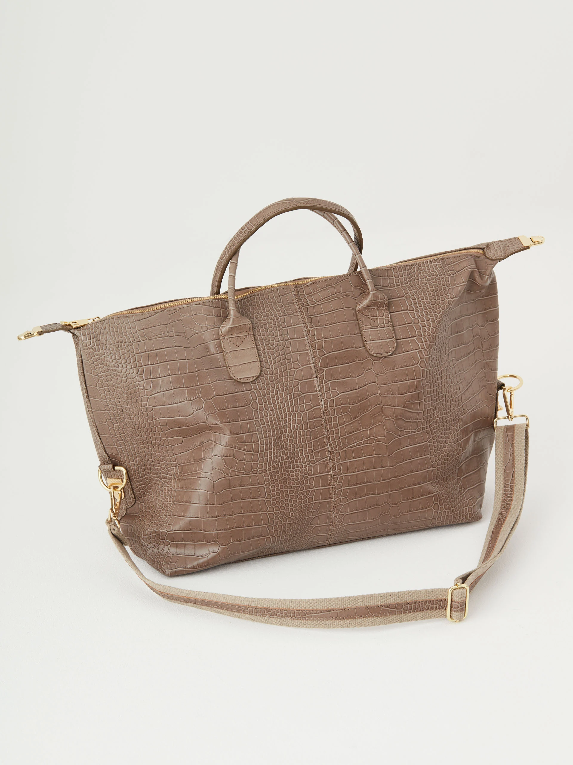 Beige travel bag with crocodile texture