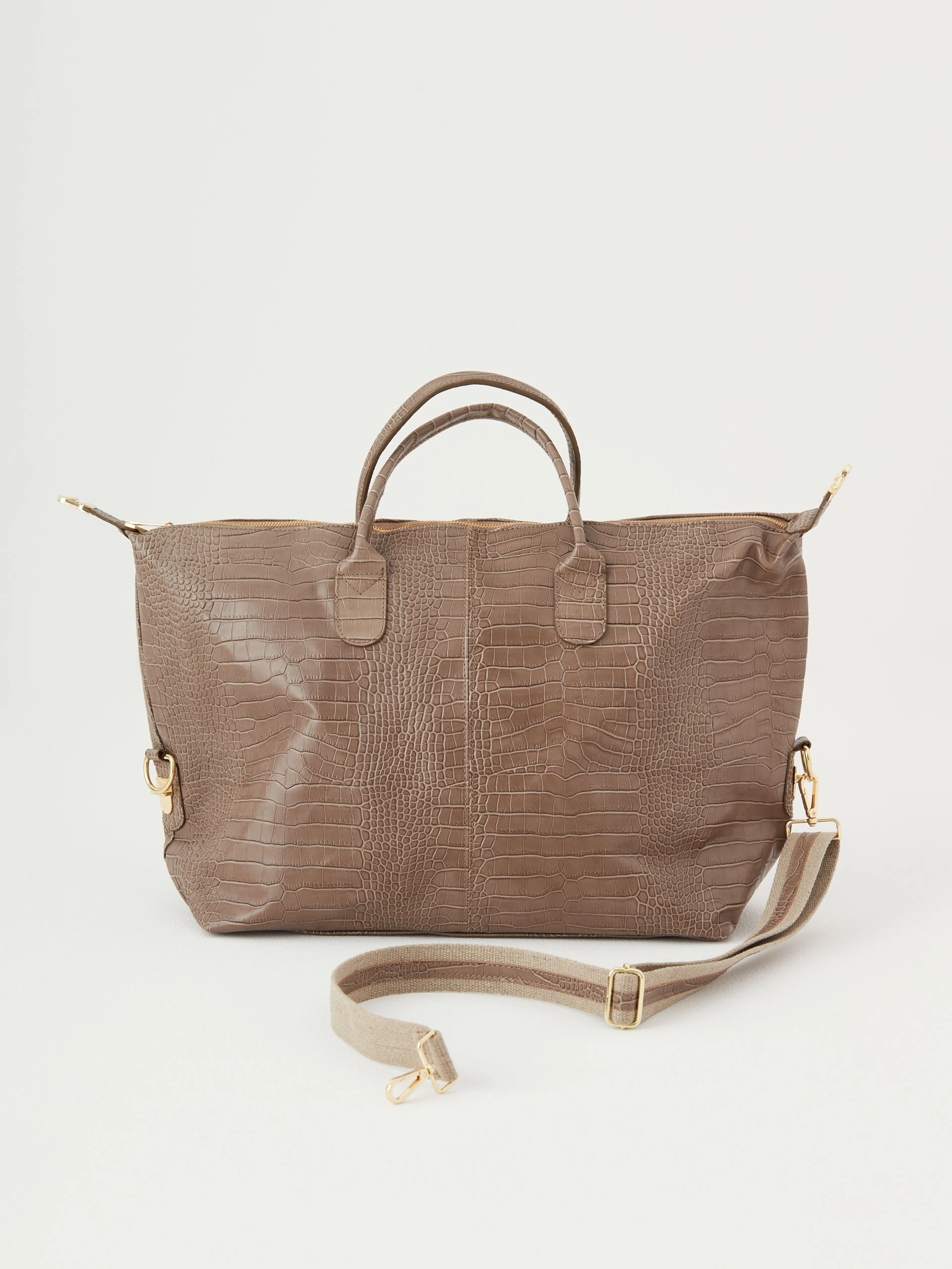 Beige travel bag with crocodile texture