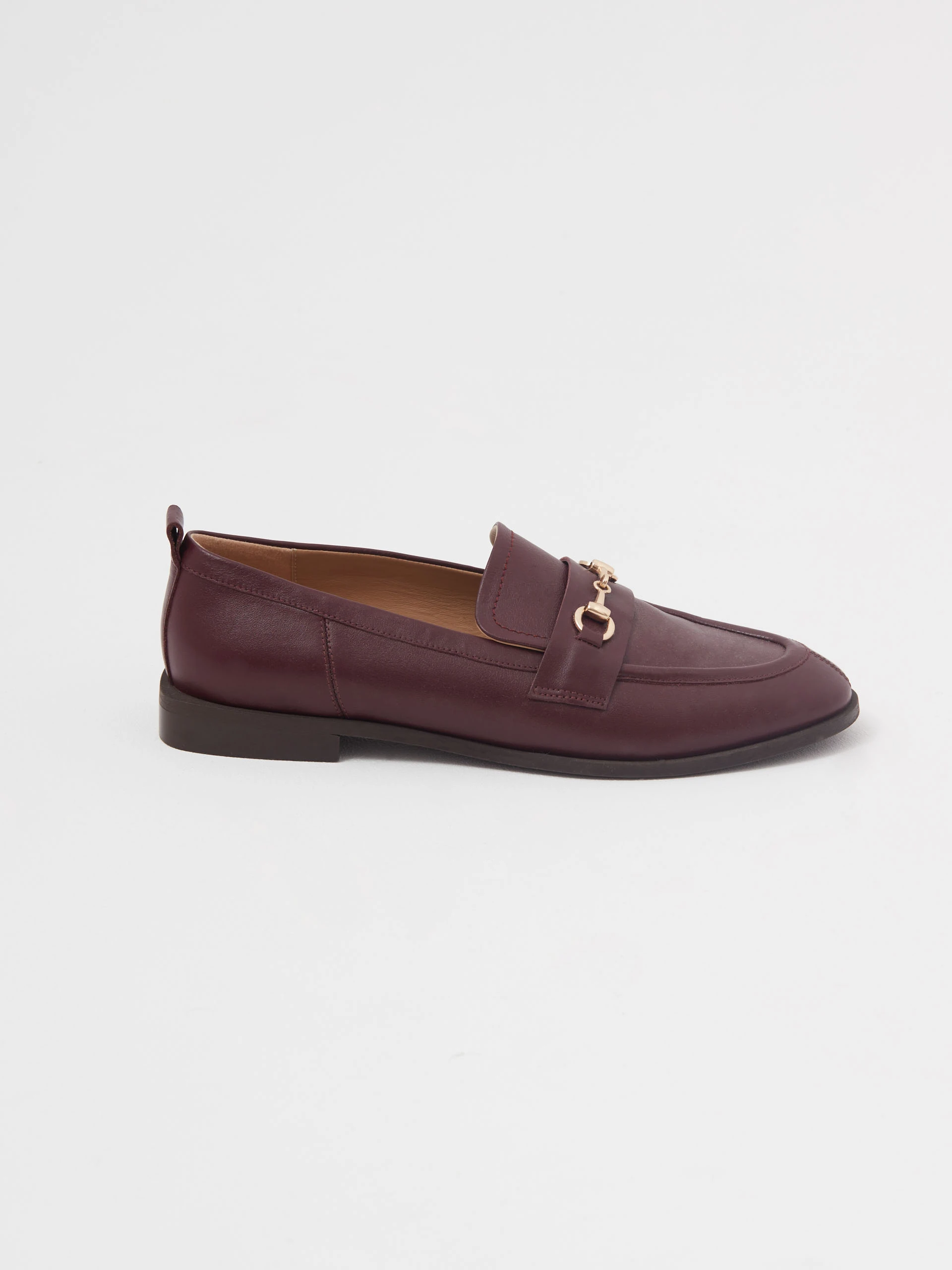 Burgundy leather moccasins with metal buckles