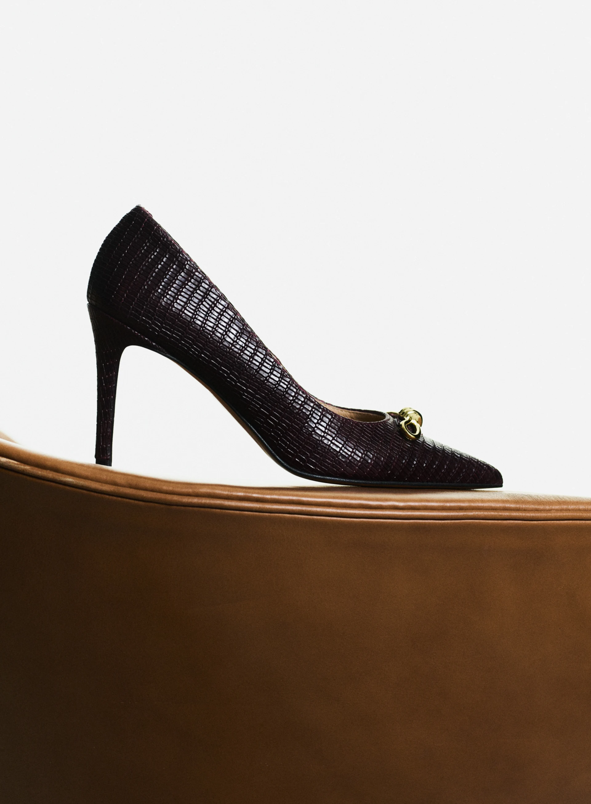 Burgundy leather pumps with decorative bows
