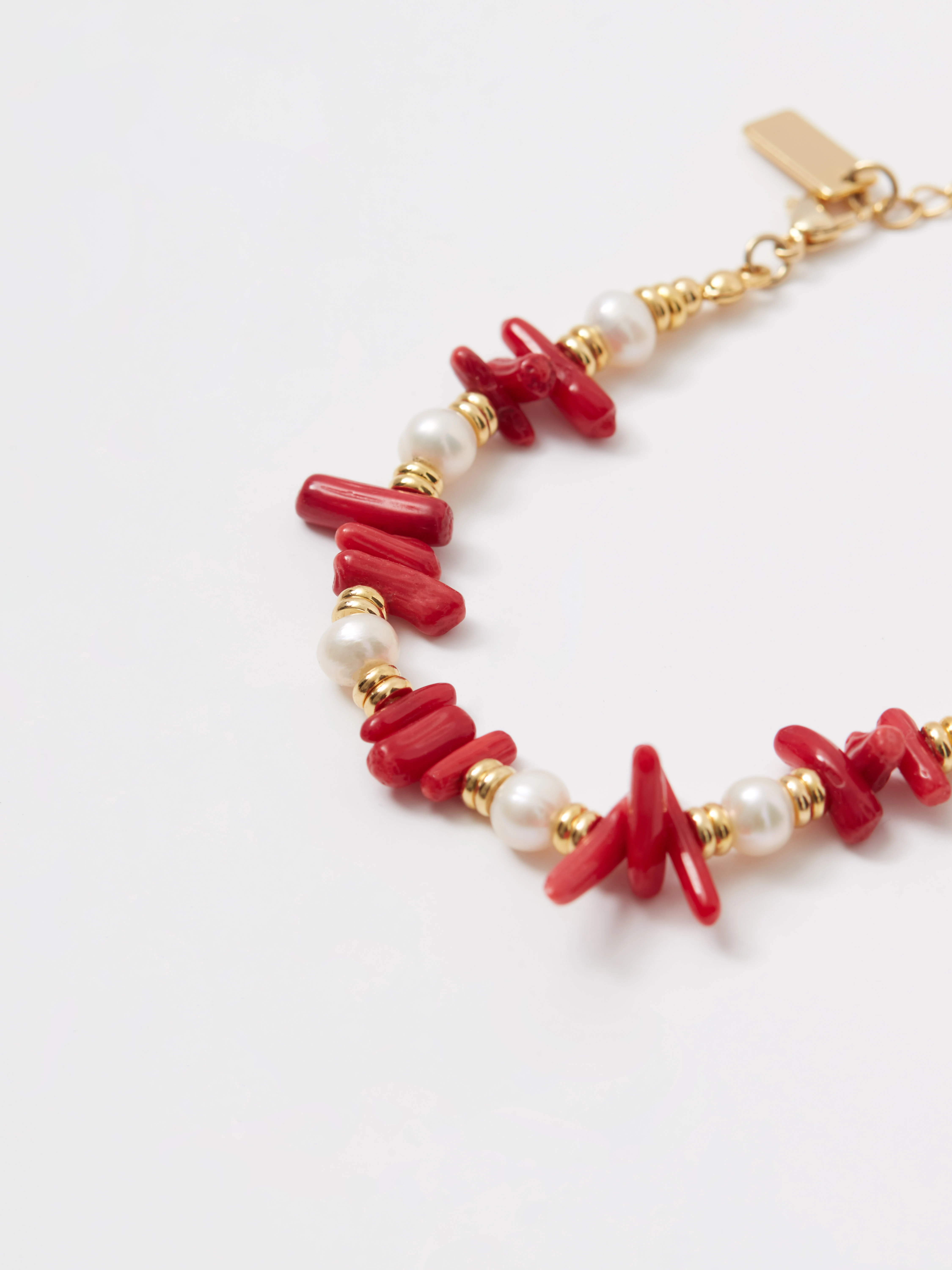 Gold-plated bracelet with pearls and red beads