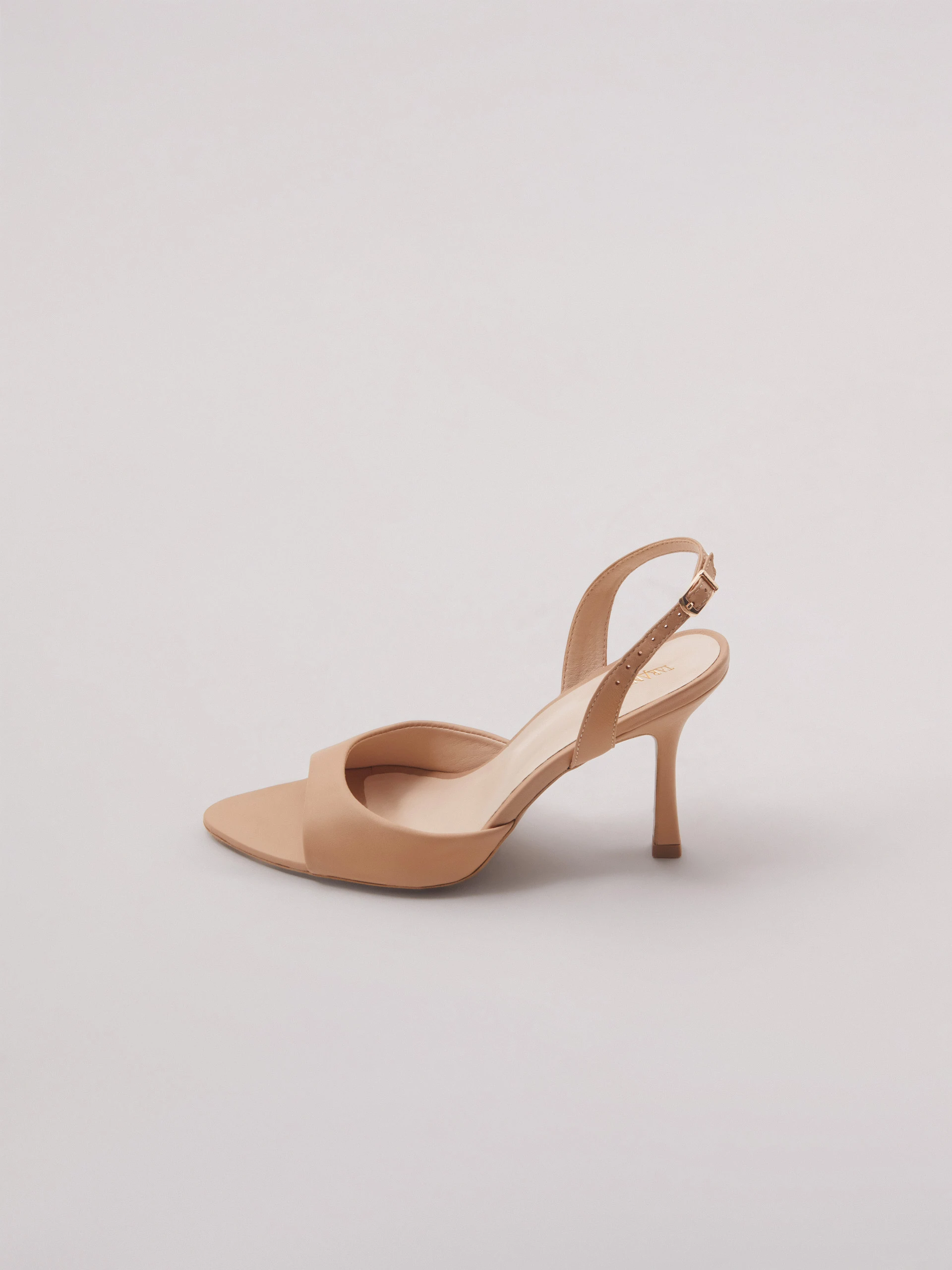 Beige open-heel pumps