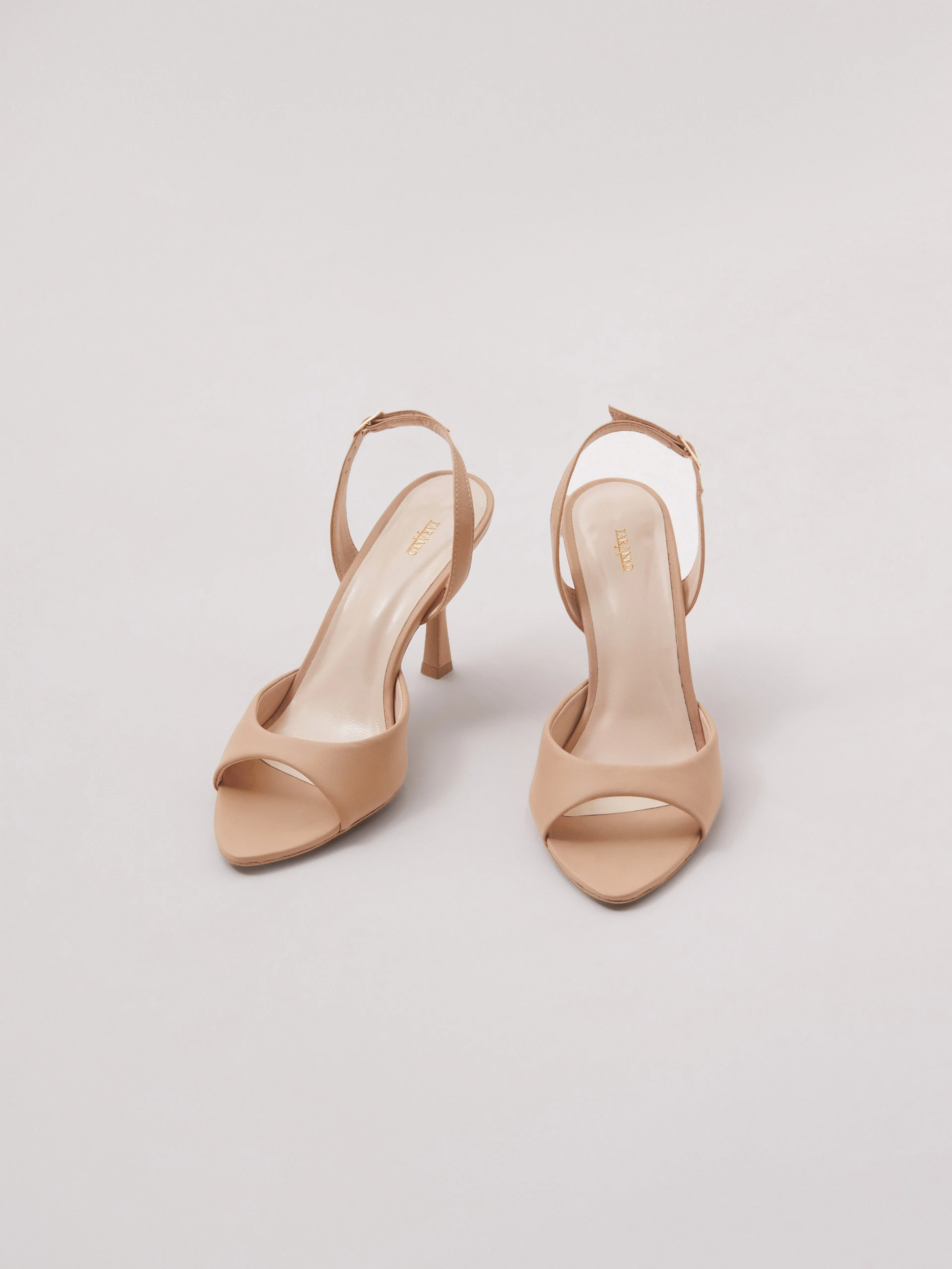 Beige open-heel pumps