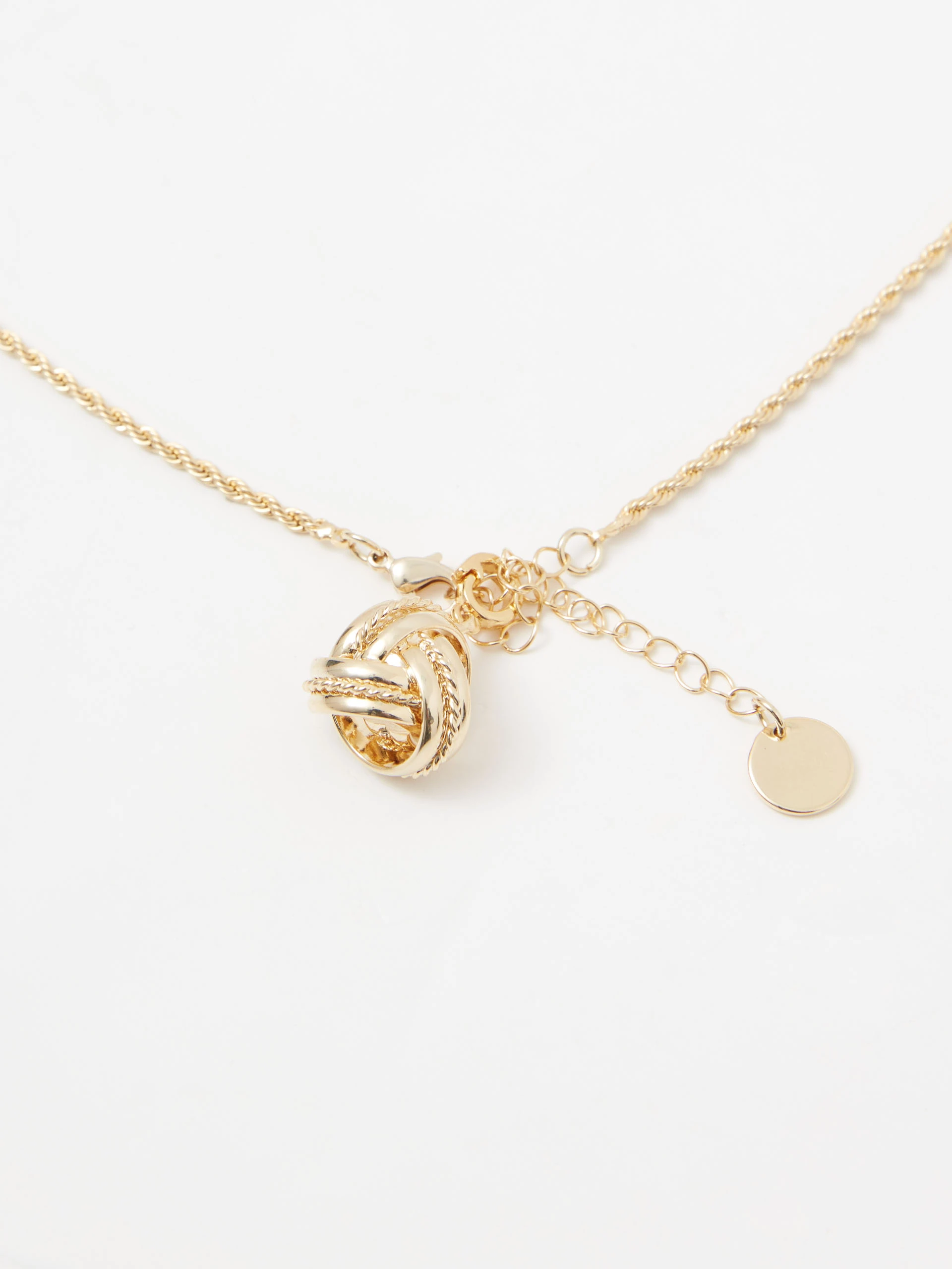 Gold-plated necklace with a knot-shaped pendant