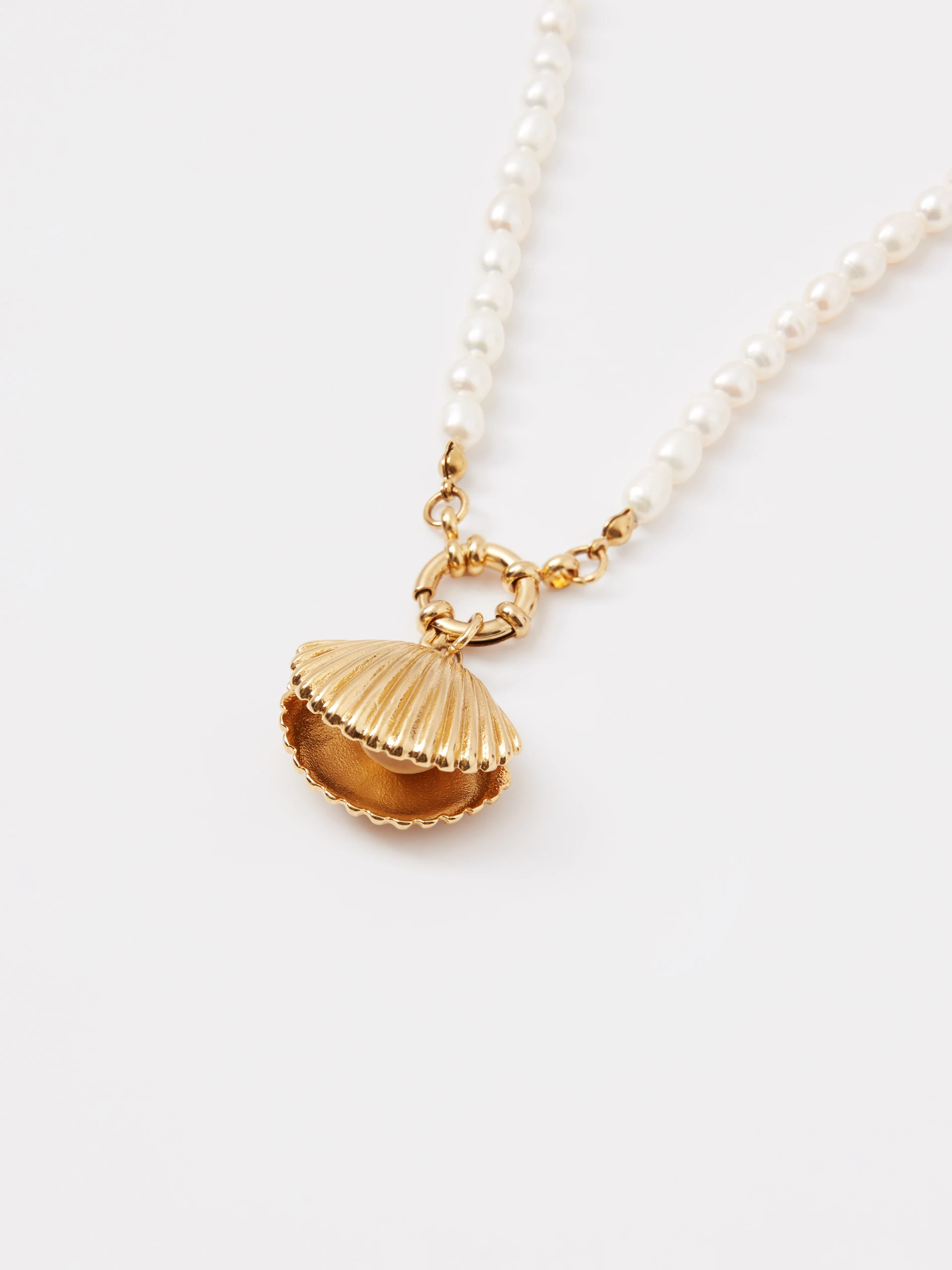 A necklace made of natural pearls with a gold-plated pendant