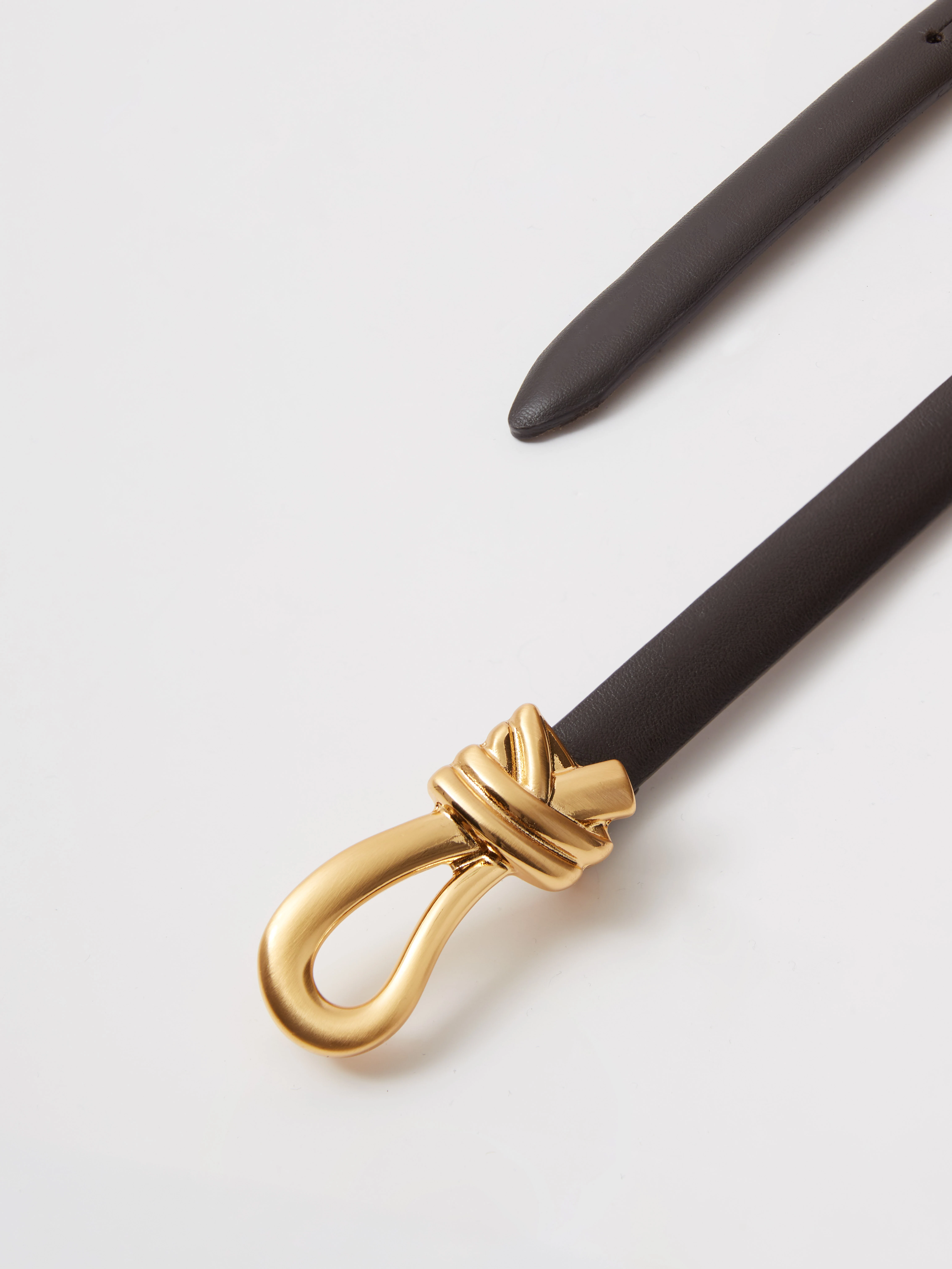 Leather belt with a decorative buckle