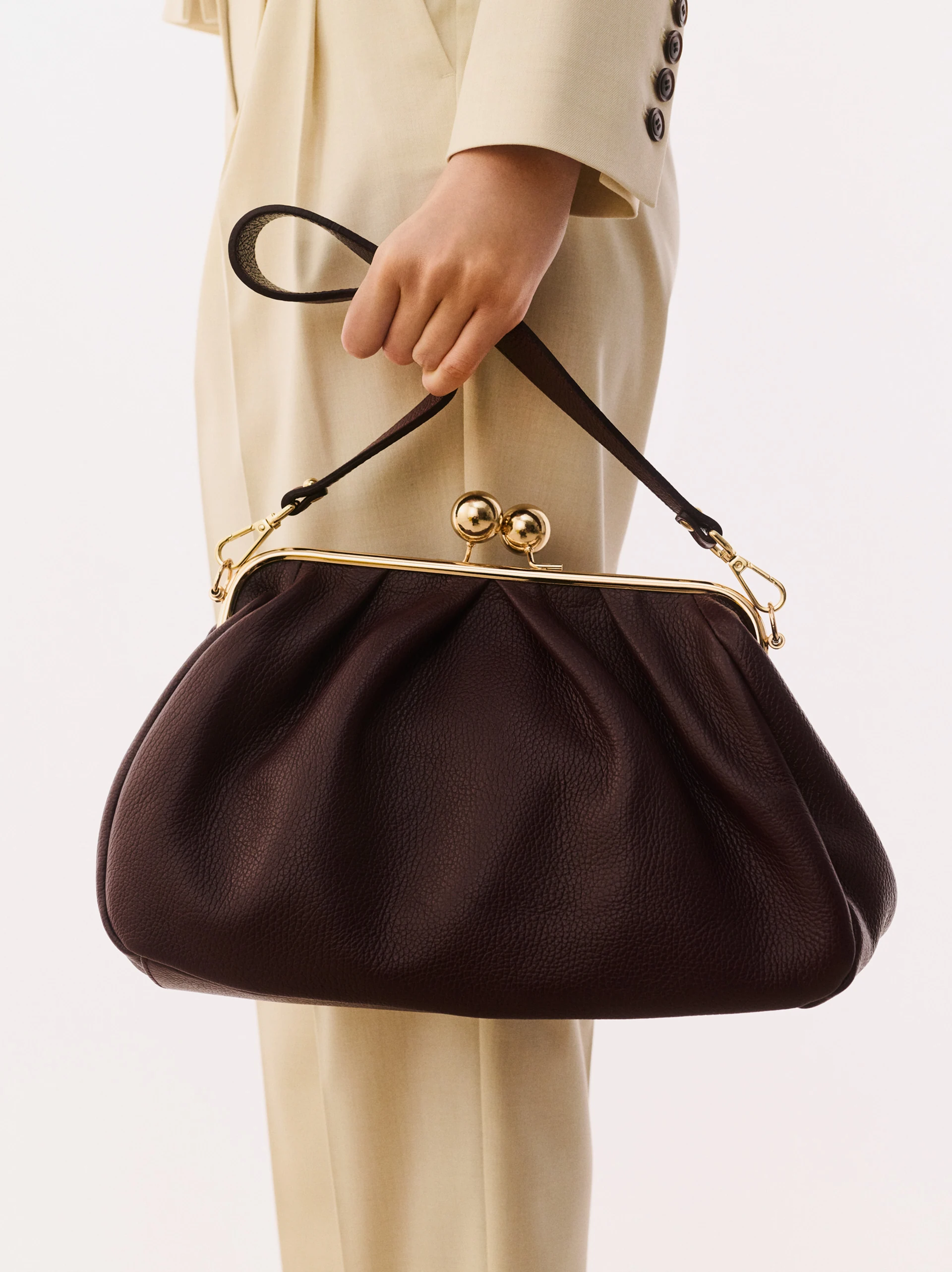 Elegant burgundy handbag with ruffles