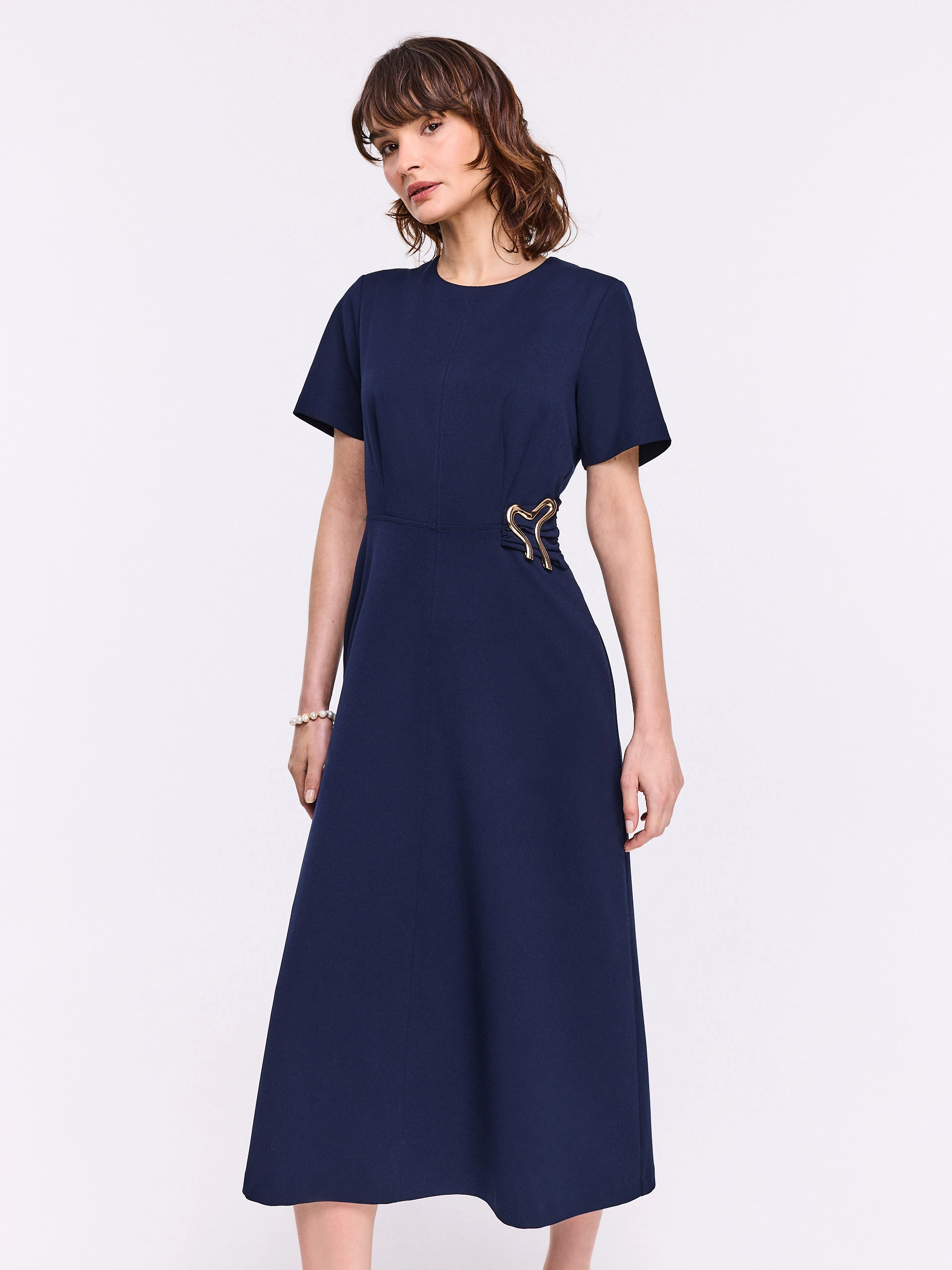 Navy blue flared dress with decorative buckle