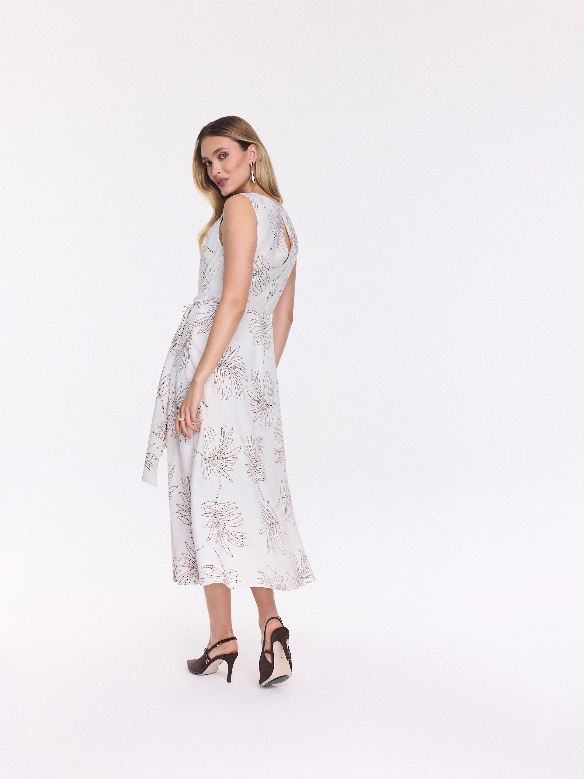 White midi dress with a leaf pattern
