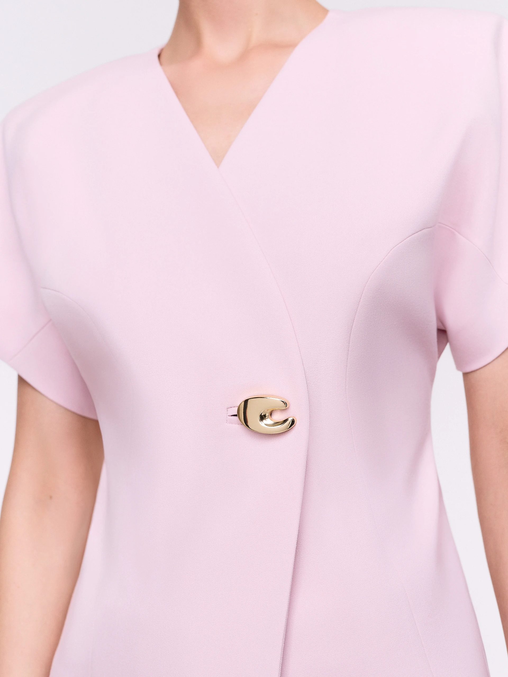 An elegant jacket with a decorative fastening