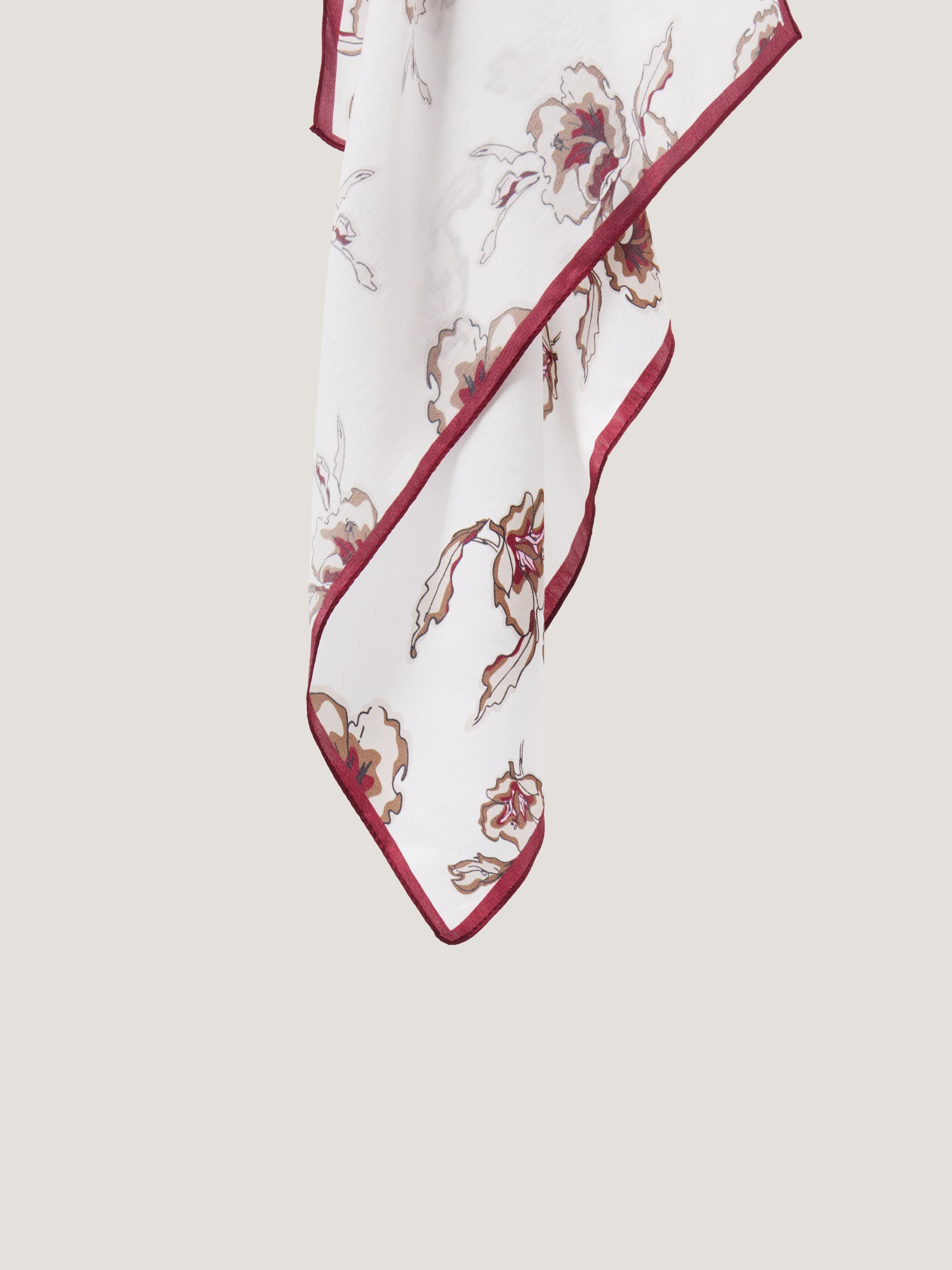 An elegant silk scarf with a floral pattern