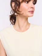 Light yellow sleeveless top with decorative trim