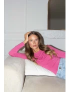 Pink blouse with ruffles and long sleeves