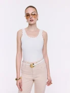 Cream-colored cotton top with decorative flowers