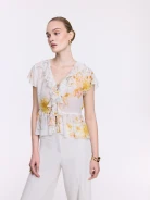 Cream-colored floral blouse