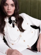 Knitted sweater with decorative buttons and collar