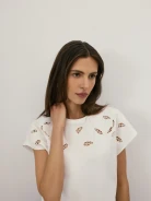 A white blouse with openwork detailing