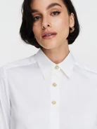 Elegant white shirt with decorative buttons