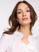 White blouse with a tie at the neck