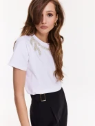 White blouse with short sleeves and decorative patch