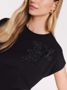 Black blouse with short sleeves and patch applique