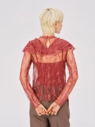 Lace blouse with brick-colored embellishments