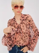 Airy pink spotted blouse with a tie at the neck