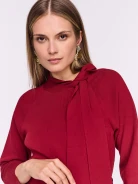Burgundy knit dress with a tie at the neckline