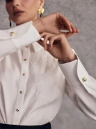 Elegant white shirt with embroidered pattern