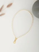 PEARL BRACELET WITH HEART-SHAPED CHARM