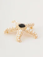Starfish-shaped brooch with pearls