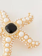 Starfish-shaped brooch with pearls
