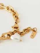 Elegant bracelet in gold color with artificial pearl
