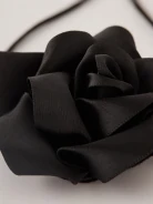 Black rose necklace on a thong