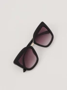 Black sunglasses with decorative inserts