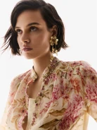 Long gold-plated earrings with decorative flowers