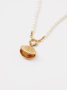 A necklace made of natural pearls with a gold-plated pendant