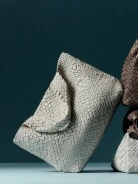 Creamy bag made of woven natural leather
