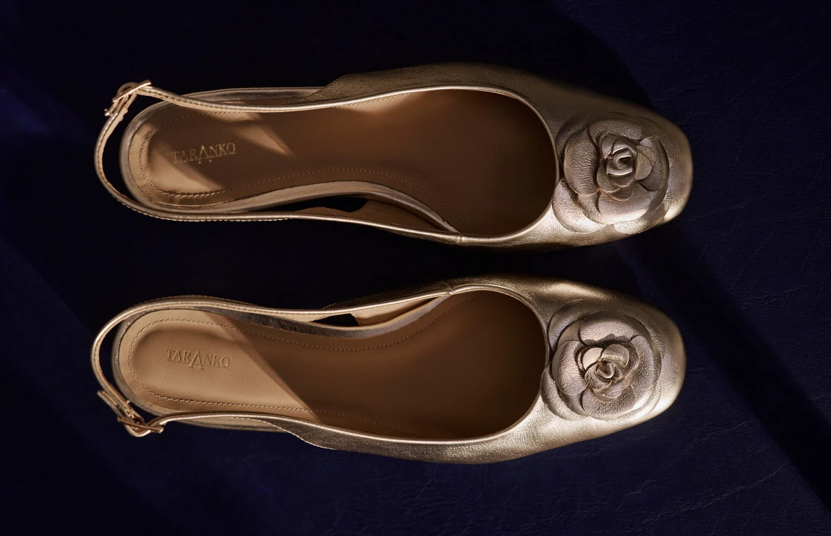 Golden leather shoes with floral appliqué