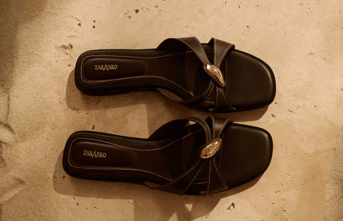 Brown leather flip-flops with decorative buckles